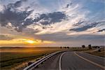 USA, Montana, Bozeman, rural road at sunset