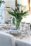 Passover Seder Table Setting in Dining Room with Silverware and Fine China