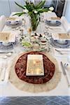 Fully Set Passover Seder Table with Seder Plate, Matzah Cover and Haggadah