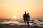 Couple on beach at sunset