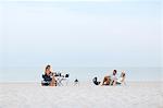 Family relaxing on beach