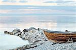 Wooden boat on rocky coast