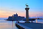 Bronze Doe and Stag statues at the entrance of Mandraki Harbour, Rhodes, Dodecanese, Greek Islands, Greece, Europe