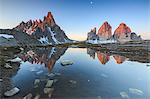 Dawn illuminates the Three Peaks and Mount Paterno  reflected in the lake, Sesto, Dolomites, Trentino-Alto Adige, Italy, Europe