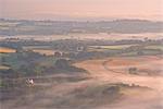 Mist covered rolling Dartmoor countryside at dawn, Devon, England, United Kingdom, Europe