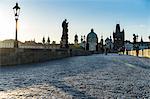 Early morning on Charles Bridge looking towards the Old Town, UNESCO World Heritage Site, Prague, Czech Republic, Europe