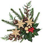 Christmas flora with gold snowflake and sparkling baubles with holly, ivy, fir and cedar cypress over white background.