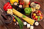 Italian food cooking ingredients. Pasta, vegetables, spices. Top view