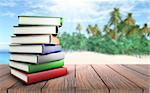 3D render of a stack of books on a wooden table looking out to a palm tree beach