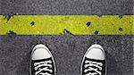 Cross the yellow line ? Concept illustration showing shoes in front of a yellow line.