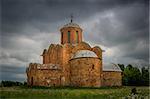 Ancient red stone cathedral view with rain clouds. Novgorod, Russia