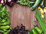 Fresh farmers garden vegetables on wooden table. Top view with copy space