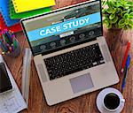 Case Study Concept. Modern Laptop and Different Office Supply on Wooden Desktop background.