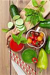 Fresh vegetable smoothie on wooden table. Tomato and cucumber. Top view