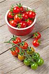 Cherry tomatoes on wooden table. Top view