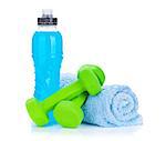 Two green dumbells, towel and water bottle. Fitness and health. Isolated on white background