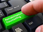Person Click on Green Keyboard Button with Text Rehabilitation Counseling. Selective Focus. Closeup View.