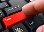 Person Click on Red Keyboard Button with Text Like. Selective Focus. Closeup View.