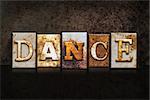 The word "DANCE" written in rusty metal letterpress type on a dark textured grunge background.