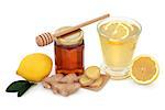 Cold and flu remedy cure with relief drink of ginger, lemon and honey over white background.