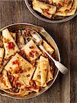 close up of rustic italian pasta in ragu sauce