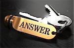 Keys with Word Answer on Golden Label over Black Wooden Background. Closeup View, Selective Focus, 3D Render.
