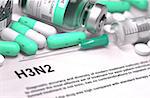 H3N2 - Printed Diagnosis with Mint Green Pills, Injections and Syringe. Medical Concept with Selective Focus.