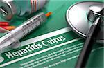 Diagnosis - Hepatitis C virus. Medical Concept on Green Background with Blurred Text and Composition of Pills, Syringe and Stethoscope. Selective Focus.