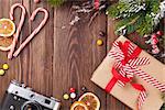 Christmas background with gift box, camera and fir tree branch