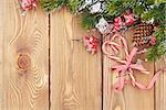 Christmas wooden background with snow fir tree and candy cane
