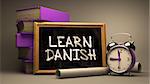 Hand Drawn Learn Danish Concept  on Chalkboard. Blurred Background. Toned Image.