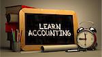 Hand Drawn Learn Accounting Concept  on Chalkboard. Blurred Background. Toned Image.