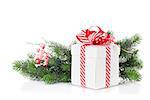 Christmas gift box and fir tree branch. Isolated on white background