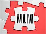 MLM - Multi Level Marketing - Text on Puzzle on the Place of Missing Pieces. Scarlett Background. Close-up. 3d Illustration.
