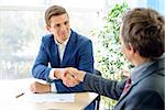 Business People Shaking Hands after Signing the Contract. Business Partnership Concept