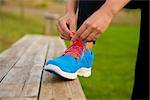 Woman tying her shoes and getting ready for train