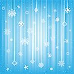 The white snowflakes hanging on strings on the blue mesh background