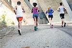 Joggers running on bridge, Arroyo Seco Park, Pasadena, California, USA