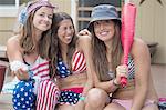 Portrait of three young women wearing American flag costume  celebrating Independence Day, USA