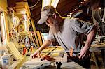 Wood artist working in workshop