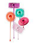 Close-up of Nail Polish Dripping from Bottles on White Background