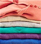 Detail of stack of multicolored wool pullovers