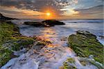 Tidal ocean flows around the rocks of Bungan Beach, Australia