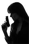 one  sexy detective woman holding gun in silhouette studio isolated on white background