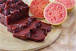 Brazilian dessert goiabada with fresh goiaba on wooden table. Selective focus