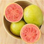 Fresh goiaba on wooden table. Selective focus. tonning effect