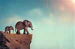 extinction concept elephant family on edge of cliff