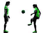 two women playing soccer players in silhouette isolated on white background