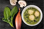 Delicious portion of mushroom cream soup with spinach