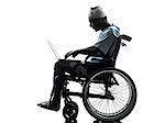 one injured man in wheelchair in silhouette studio on white background